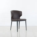 Chaise de salle à manger moderne du milieu du siècle en similicuir avec dossier enveloppant