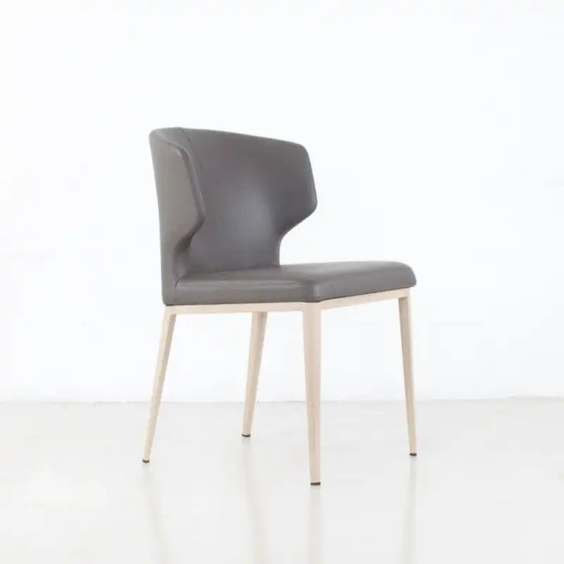 Chaise de salle à manger moderne du milieu du siècle en similicuir avec dossier enveloppant